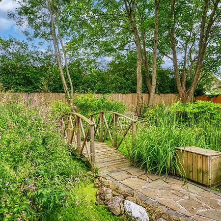 Holiday home Garden In Hidden Oasis Pass The Keys Manchester